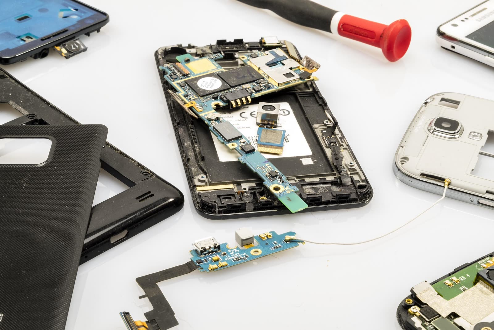 Phones disassembled on the workshop bench